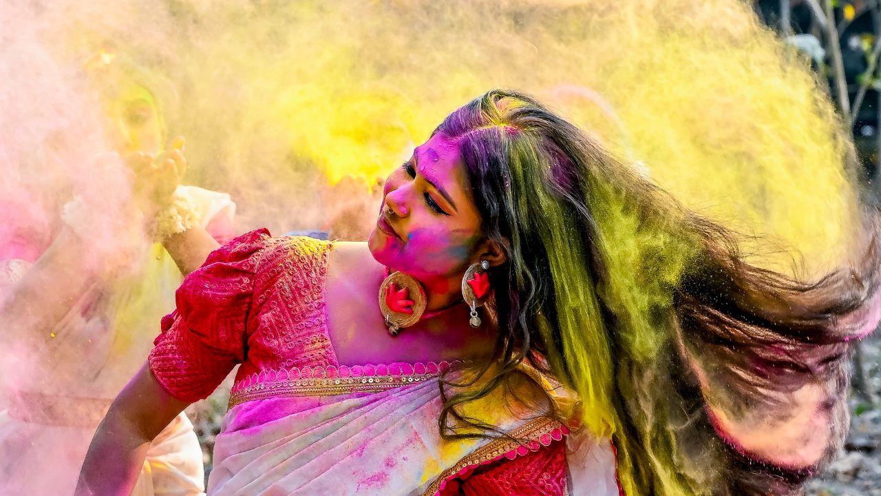 A young woman in Nadia celebrates ahead of Dol Purnima, as West Bengal prepares for Holika Dahan on March 3