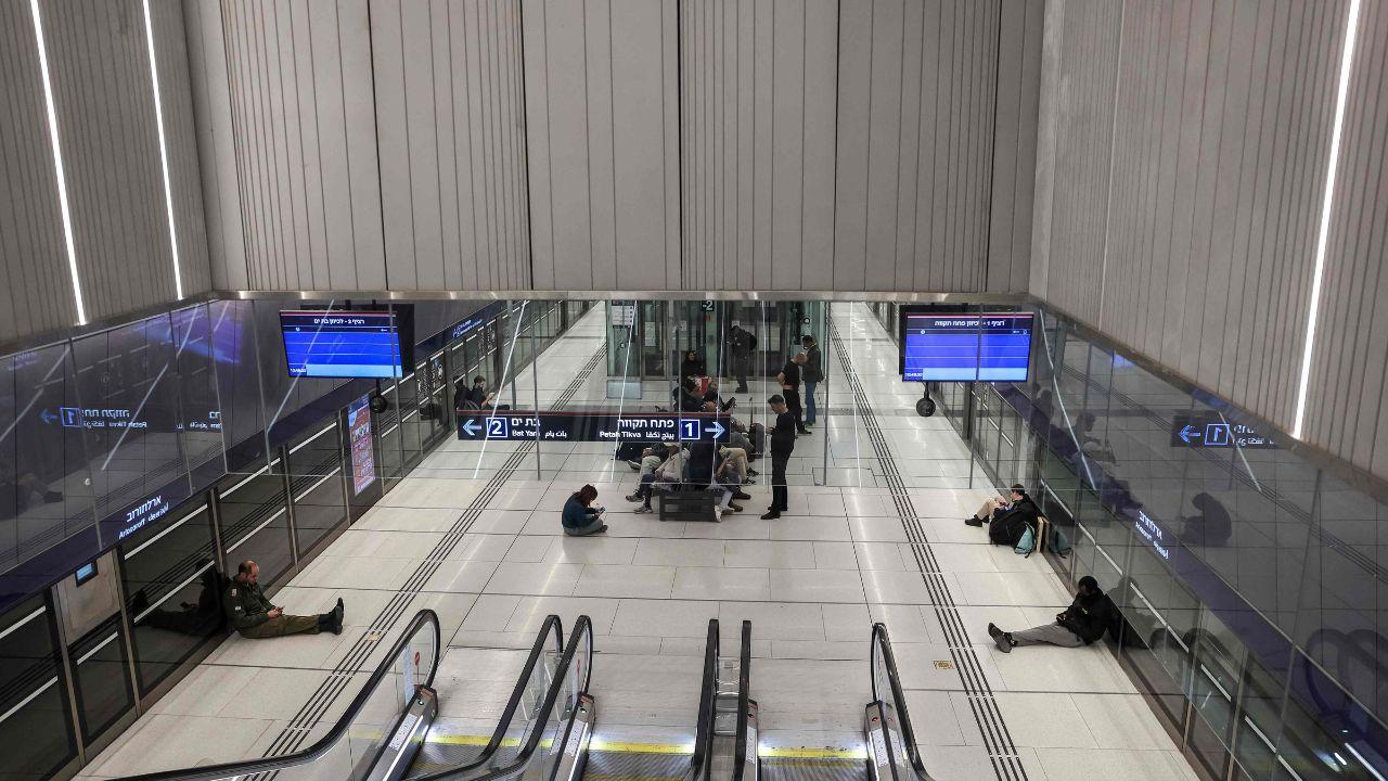 People take refuge in an underground metro station, using public infrastructure for emergency shelter during the crisis