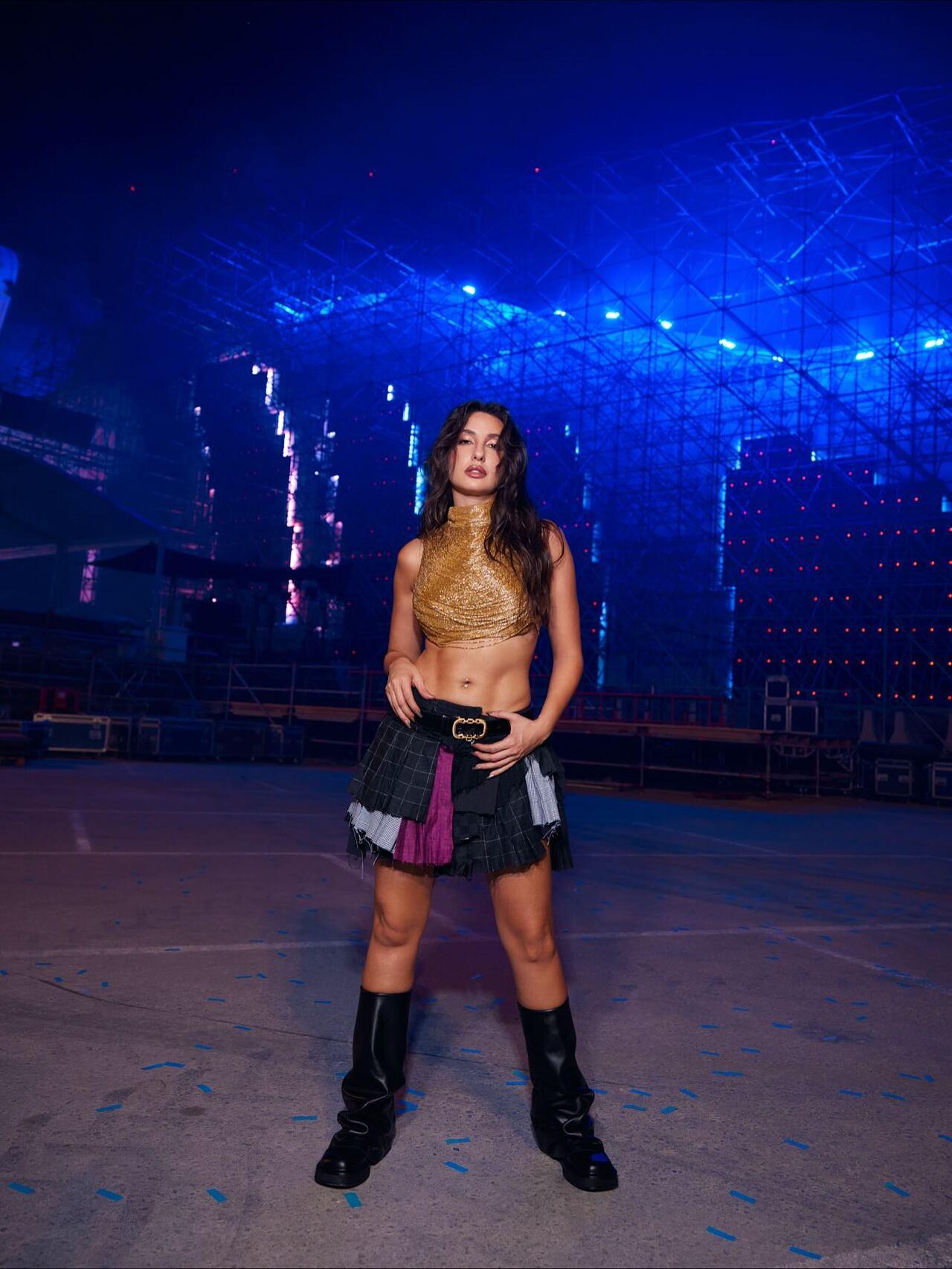 <p>Fierce, functional, and confident, this look marked the bold beginning of her pop-girl era. The recycled patchwork skirt made a clear statement, sustainability can be stage-ready and striking.</p>