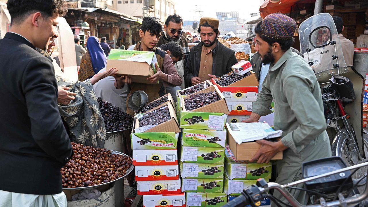 Vendors arrange fresh dates which are traditionally used to break the fast at 'Iftar'