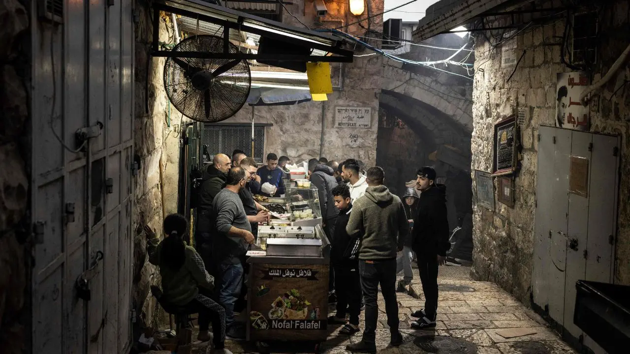 Vendors sell falafels in Jerusalem’s Old City ahead of Iftar, providing traditional foods for breaking the fast after a day of fasting