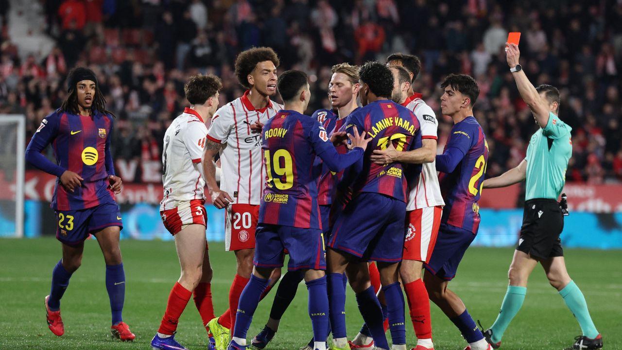 Girona's Belgian defender #20 Axel Witsel receives a red card during the Spanish league football match
