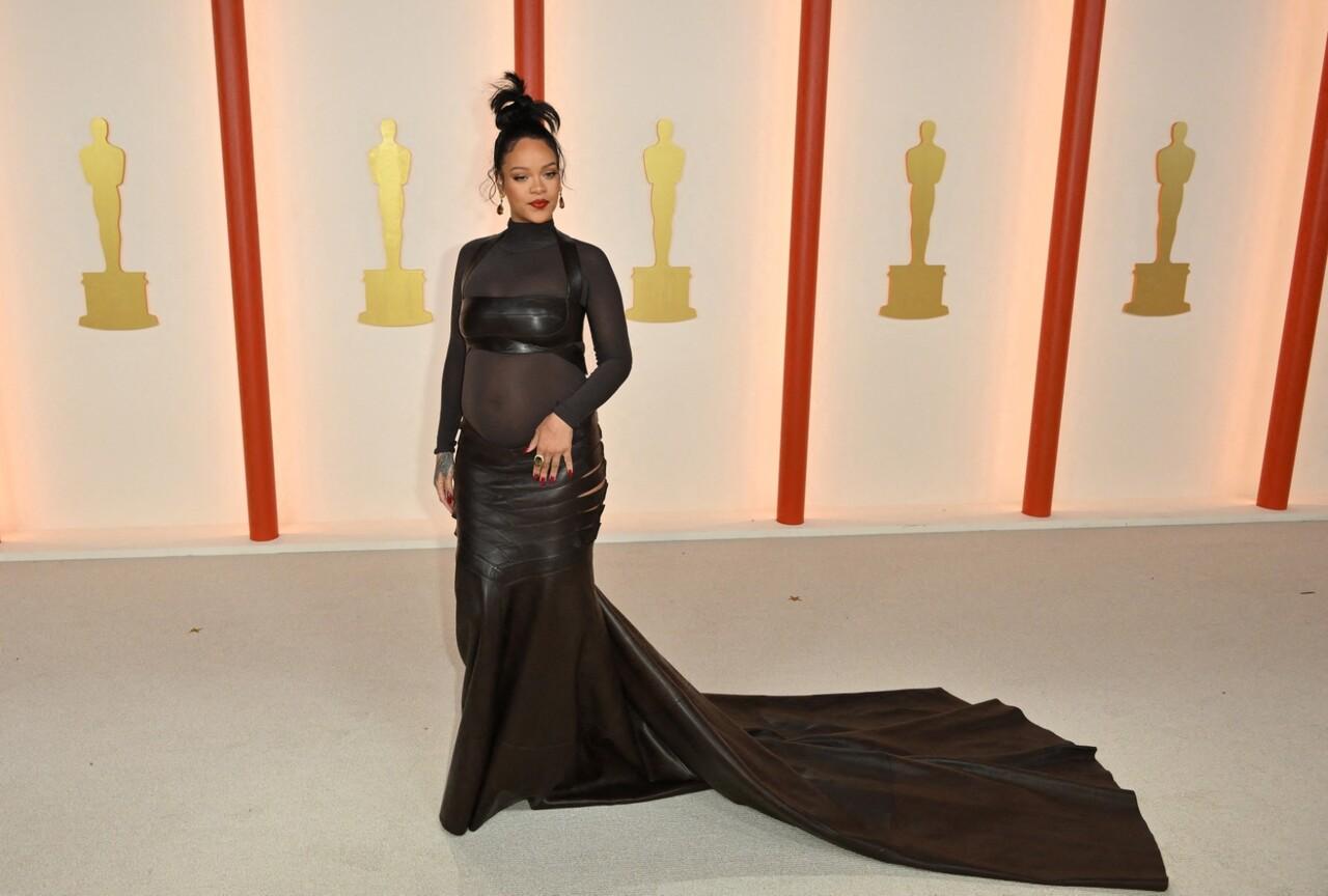 For Academy Awards, RiRi kicked off the evening in a daring black dress with long sheer sleeves. The look featured a leather bralette and a flowing skirt with edgy side cutouts.