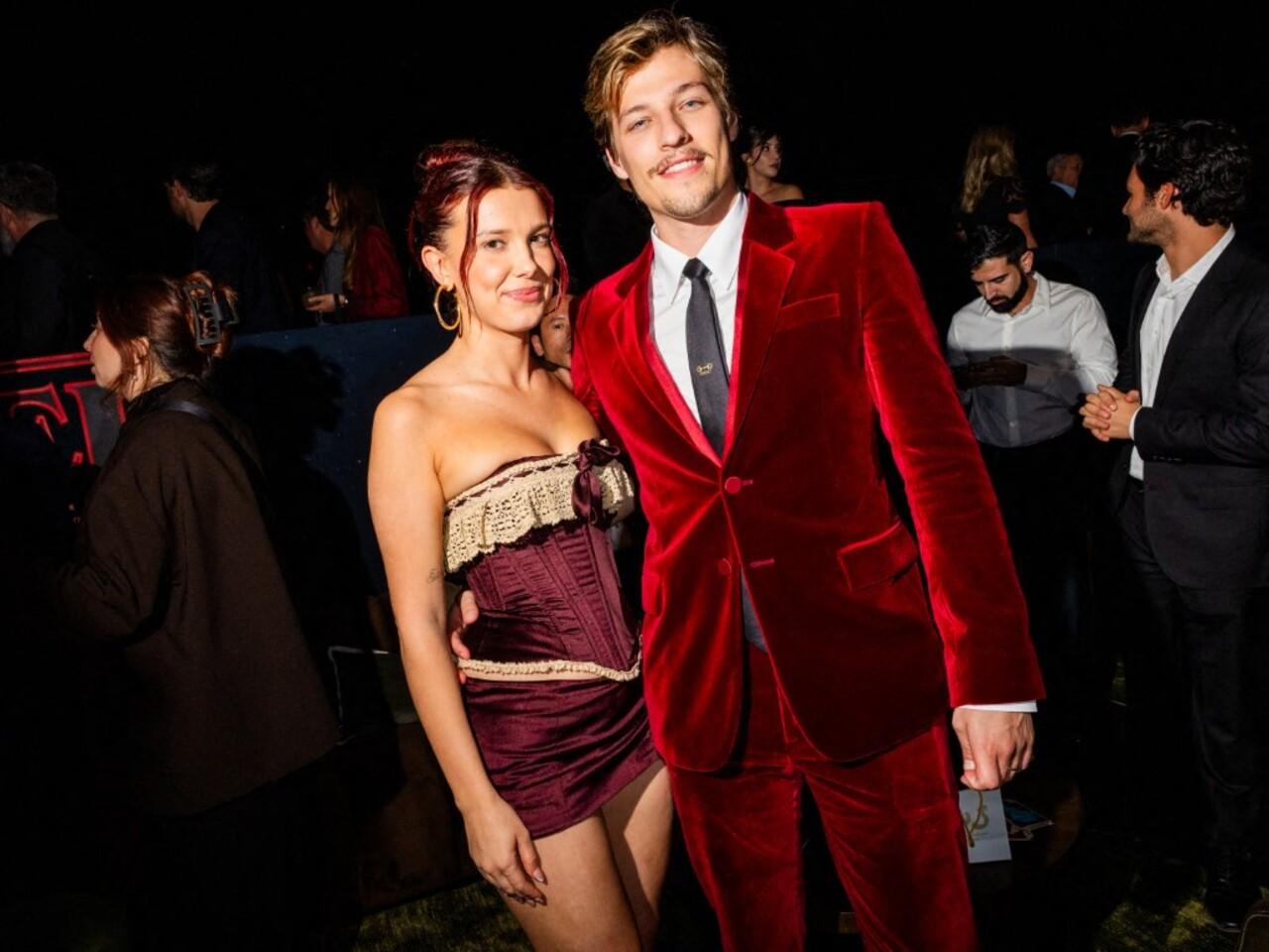 







After the premiere, Millie Bobby Brown changed into a red mini corset dress. It had delicate cream lace details on the top and bottom. The look was chic, flirty, and perfect for the after-party.







