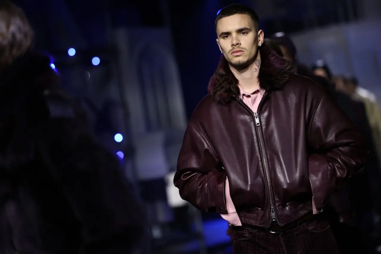 <p><span class="hover:entity-accent entity-underline inline cursor-pointer align-baseline"><span class="whitespace-normal">Romeo Beckham</span></span> made a bold style statement in a soft pink T-shirt layered under a rich burgundy coat. The coat featured luxe fur detailing around the neckline, adding a touch of vintage glamour.</p> <p><span class="hover:entity-accent entity-underline inline cursor-pointer align-baseline"><span class="whitespace-normal">Romeo Beckham</span></span> made a bold style statement in a soft pink T-shirt layered under a rich burgundy coat. The coat featured luxe fur detailing around the neckline, adding a touch of vintage glamour.</p>