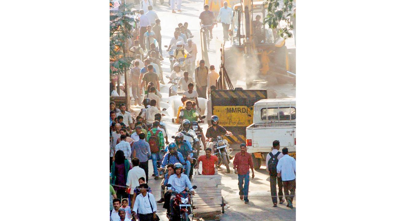 Road-digging is doubled with the ongoing construction of a mono rail line at Currey Road Bridge