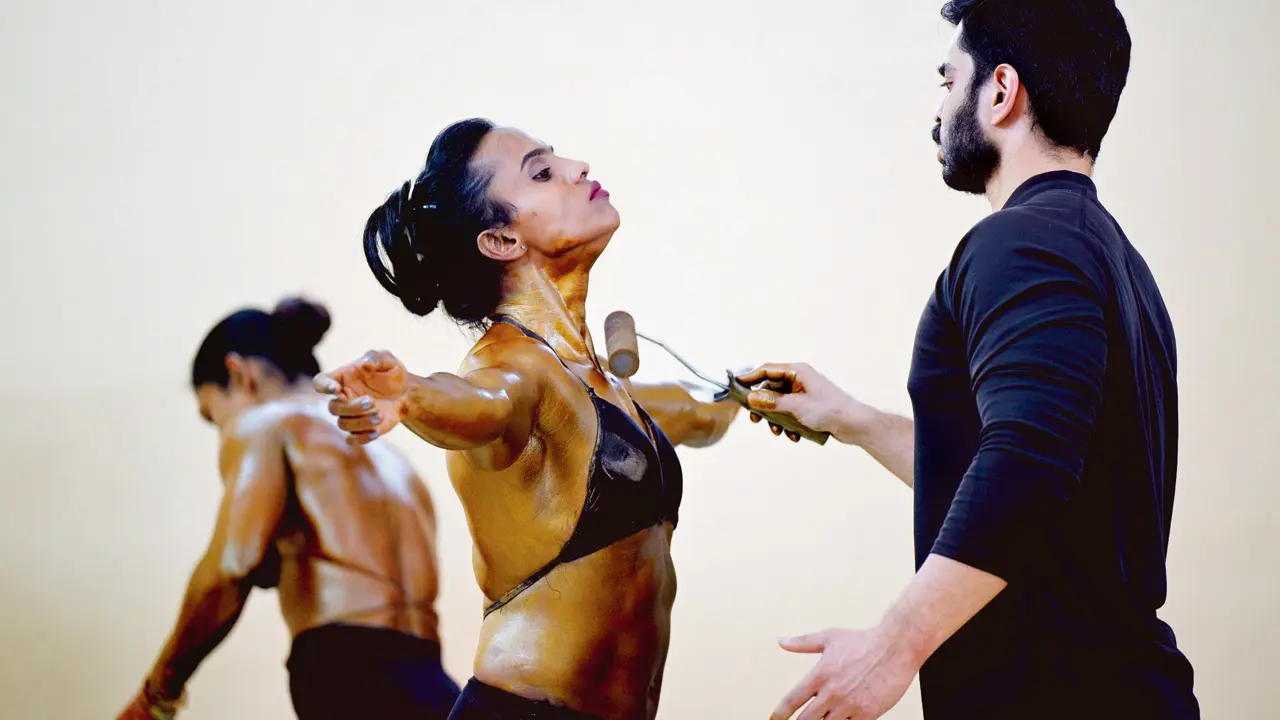 Backstage, women bodybuilders carefully applied tanning liquid to accentuate muscle definition before stepping into the spotlight. The preparation was as intense as the performance itself