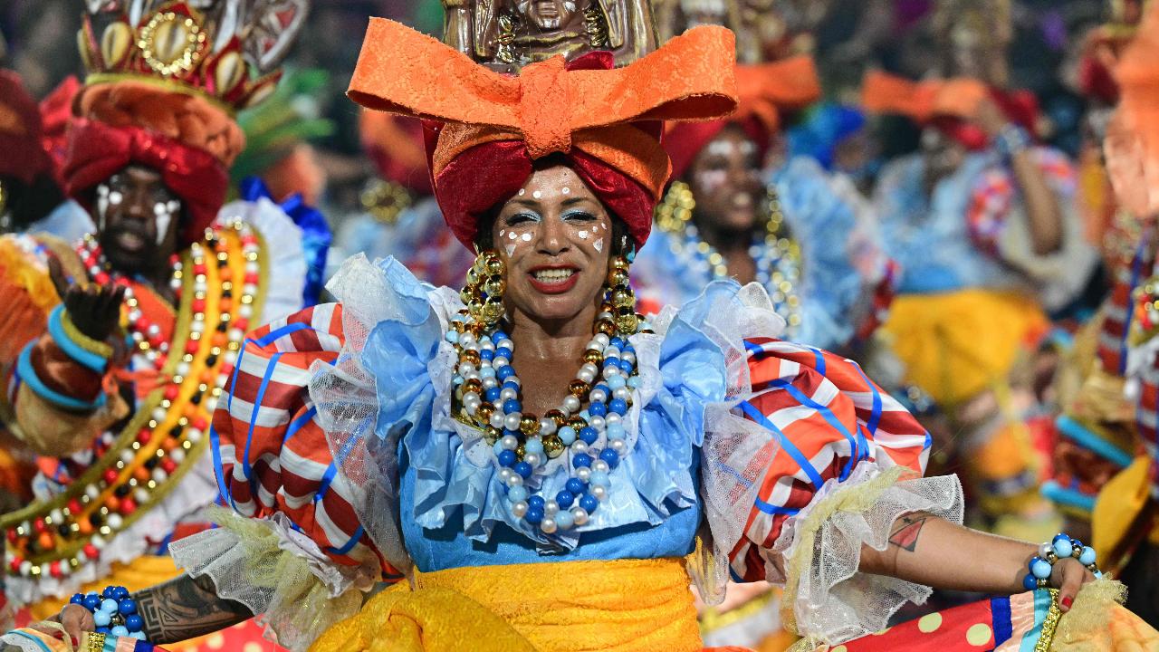 Revellers of the Unidos de Vila Isabel samba school perform during the closing night of the Rio Carnival at the Marques de Sapucai Sambadrome in Rio de Janeiro, Brazil, early on February 18