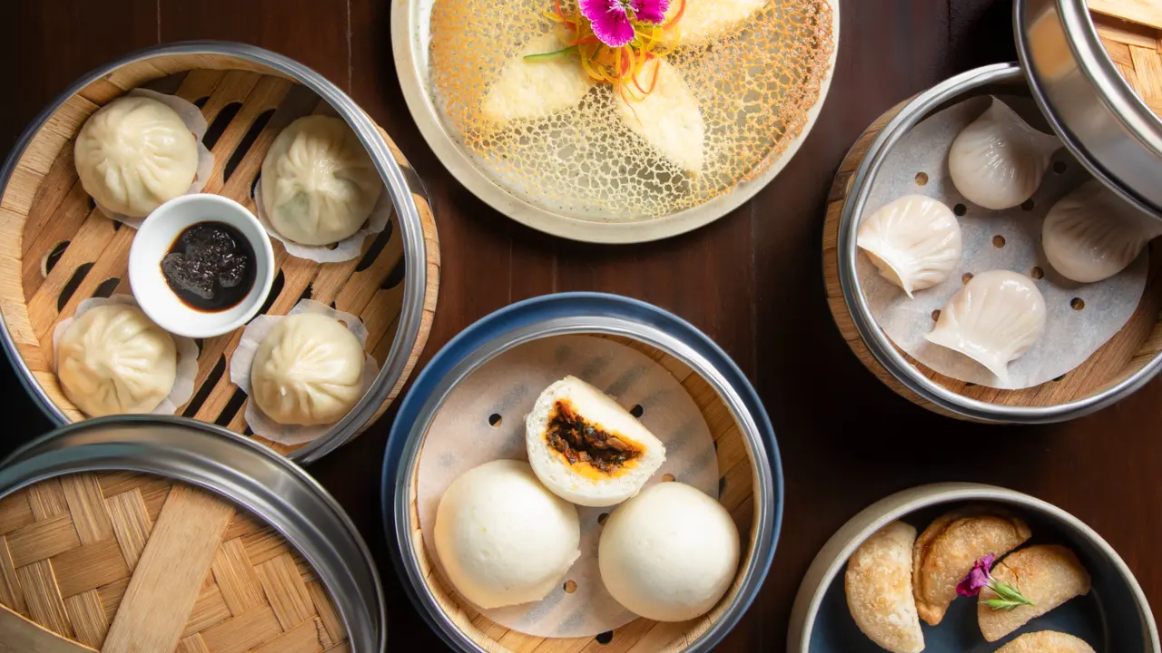 Asian delights in Kala GhodaThis Chinese New Year, The Dimsum Room turns One and welcomes the Year of the Horse, for dining experience set in the heart of Mumbai’s historic art district, Kala Ghoda.
Highlights include Mixed Mushroom Cheung Fung, the comforting Silken Tofu Xiao Long Bao, and Asparagus & Water Chestnut Tossed Wontons. It also has classic favourites such as Pork & Shrimp Siu Mai, Prawn Hargow, and Prawn Toast along with bites like Chicken Coriander & Celery Potstickers and Chicken & Chives Wontons.
The main course has Braised Pork Belly (Lou Rou Fan), Cantonese Roast Duck Plate, and Dan Dan Noodles and Mapo Tofu with Jasmine Rice. A beautifully prepared John Dory adds a refined seafood touch to the feast. End your meal with desserts like Hong Kong–Style Compressed French Toast and a contemporary White Chocolate Matcha Cheesecake.
The food can be paired with cocktails and mocktails including Velvet Nightcap, Vihara, Sesame Street, and Paper Crane, designed to seamlessly complement with the flavours of the season and elevate the celebratory mood.
As part of the celebrations, every table will receive a traditional Red Envelope, thoughtfully curated to hold a special surprise adding a touch of joy and auspicious cheer to each dining experience.
Where: The Dimsum Room, Kala Ghoda, FortWhen: On till March 3Time: Available for lunch and dinnerPrice: Rs 5,000 plus taxes for two peopleCall: +91 98677 11017 for reservations