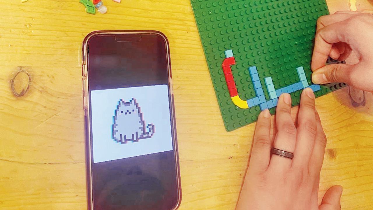 Curved tiles are assembled to form a Lego pattern 