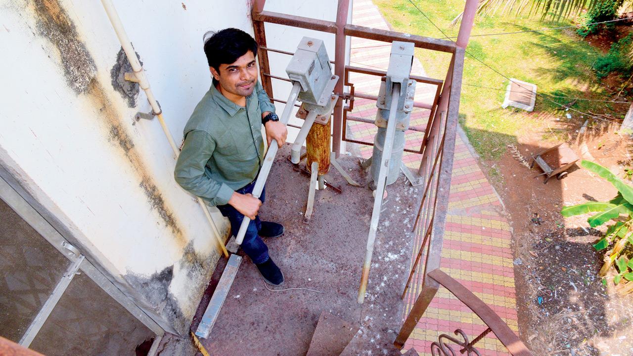 Dr Nilesh Jadhav co-founder of GERMsafe Technologies, installing their device onto a handpump. FILE PIC 