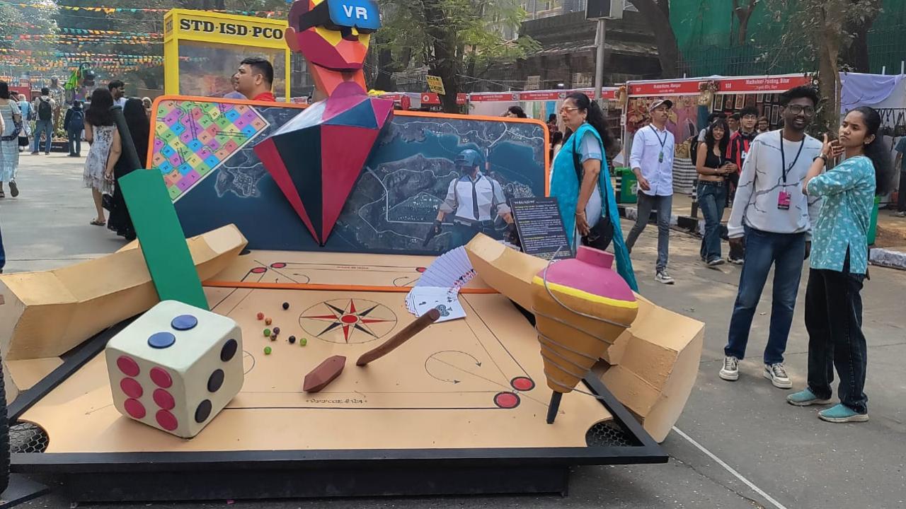 Kal Aaj Aur Kal Titled 'Kal Aaj Aur Kal', this art installation will immediately catch your eye because it is a tribute to childhood, imagination, and evolution of human creativity, say the artists. 
It not only has the bat and ball of cricket but also the spinning top, dice, tire and stick, board games, carrom, and even the most recent PUBG, and will definitely make you reminisce the past