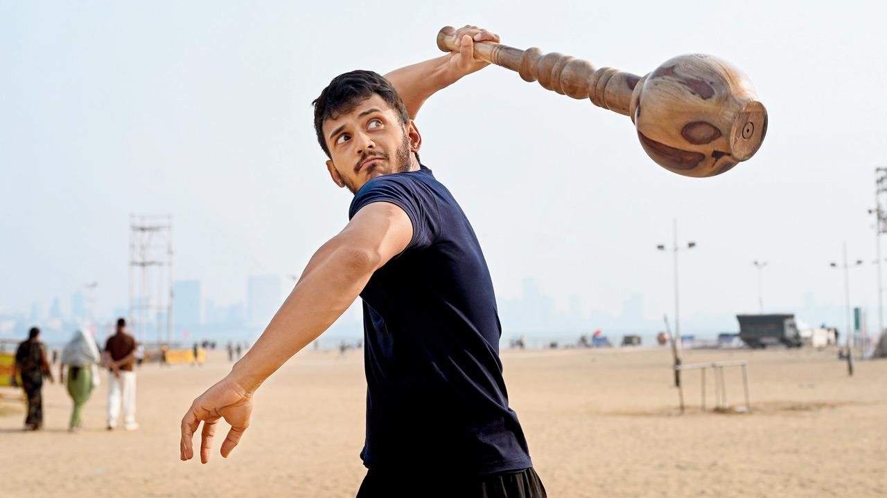 Aakash Shah swings a mace