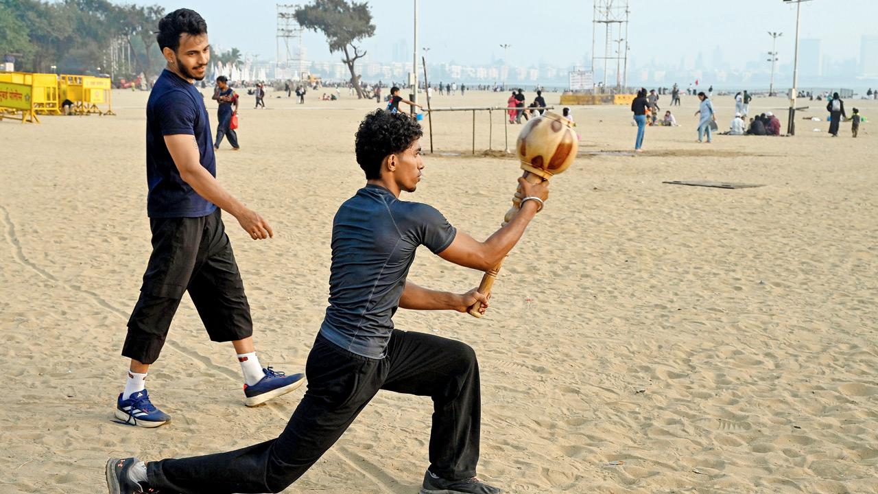 A plunge with the gada (mace) helps build lower body strength and stability for athletes and sportspersons