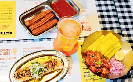 Public rice beer and Kathiawadi Lasaniya Batata Bhungla, Mushroom and Bandel cheese patishapta, and Chakli Churros and Schezwan sauce