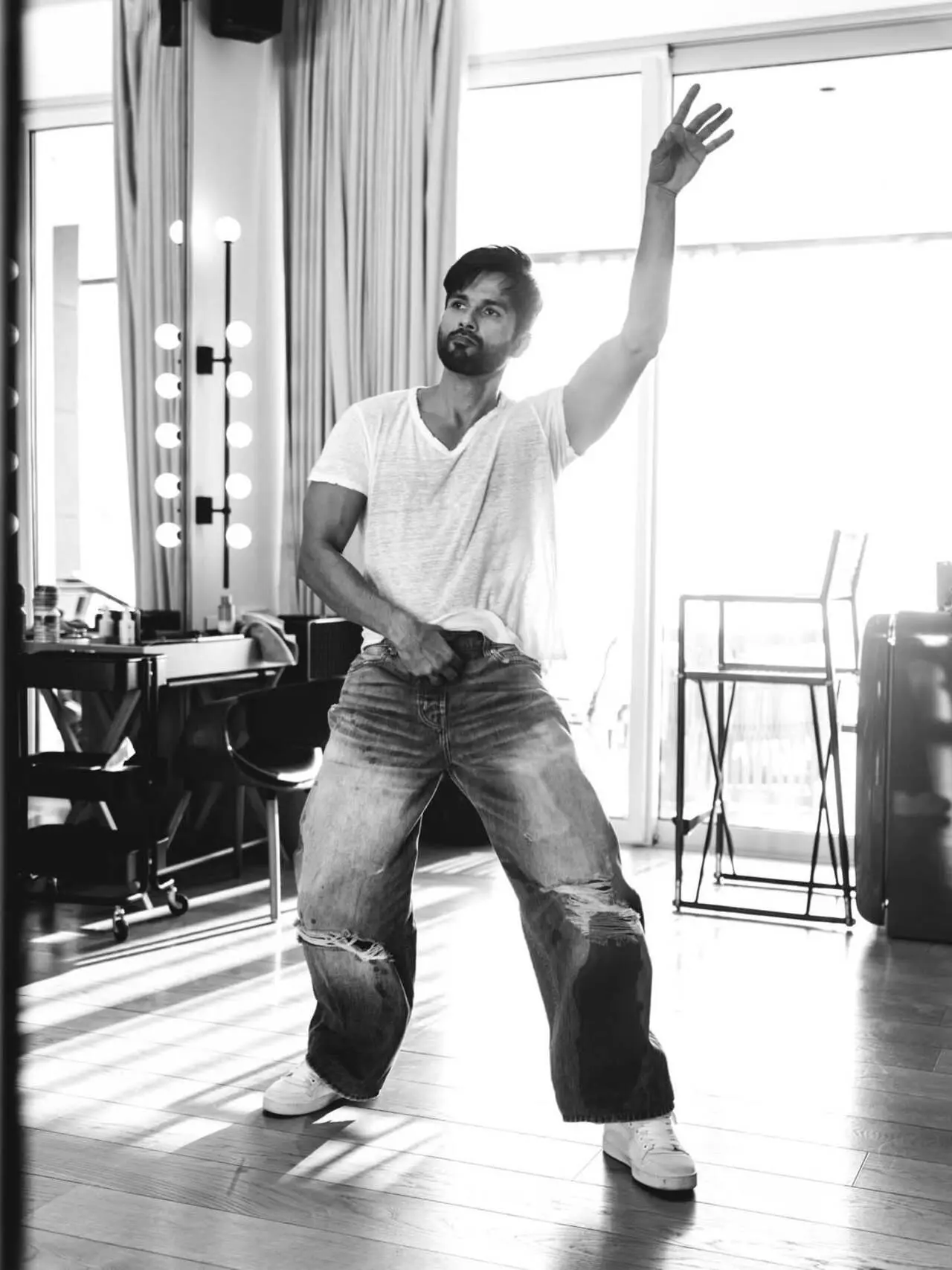 In one of the candid monochrome shots, Shahid Kapoor is captured mid-dance, exuding energy and joy.