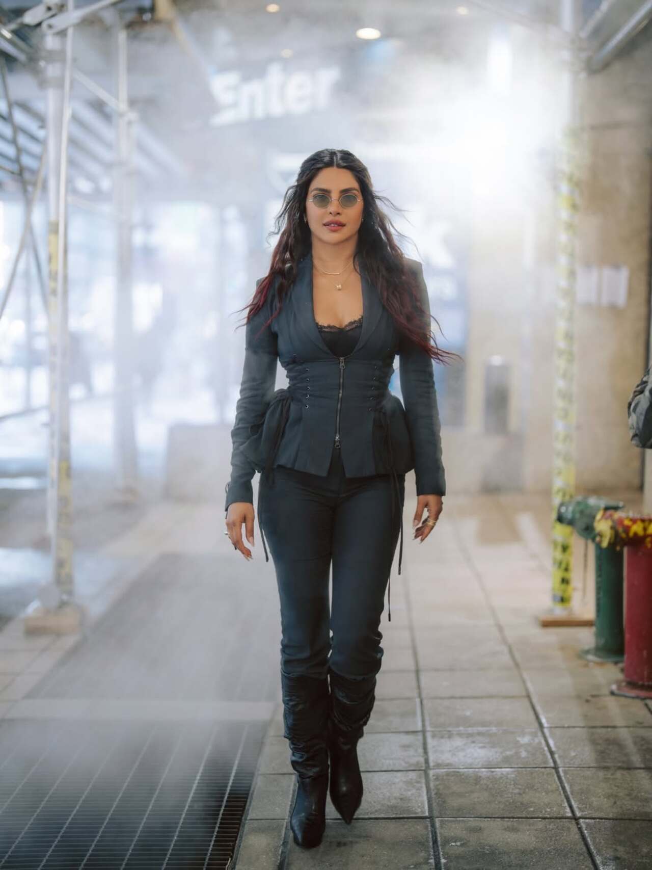 Priyanka Chopra stuns in a corset-style blazer, slim trousers and leather boots during The Bluff promotions, showcasing bold street-style glamour.