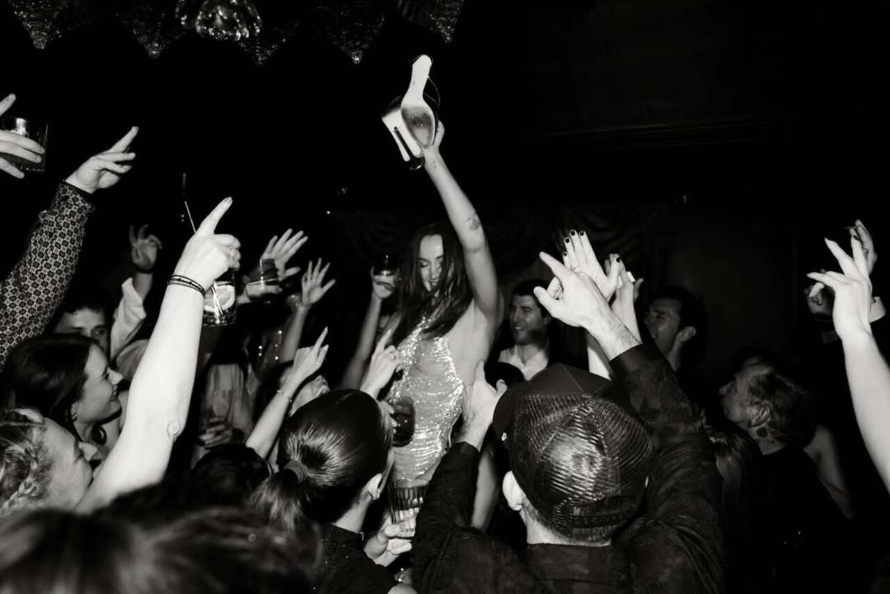 One highlight is the third image, where the future Tomb Raider star is being lifted into the air by the pals around her.