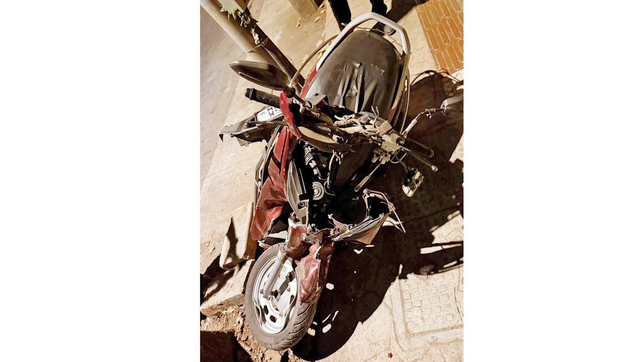 The scooter ridden by the Patels lies damaged after being hit by a speeding car near Somaiya College, Vidyavihar