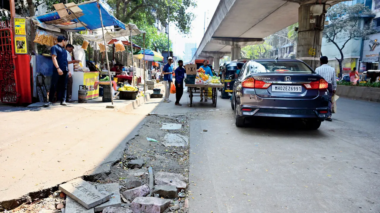 Tiles and blocks lie around on the previously dug-up space
