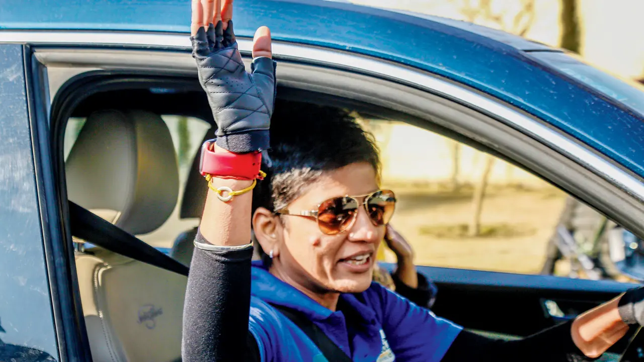 A participant waves to the crowd