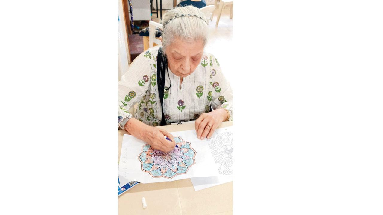 A senior citizen practises Mandala art colouring. Pic courtesy/Dignity Foundation 