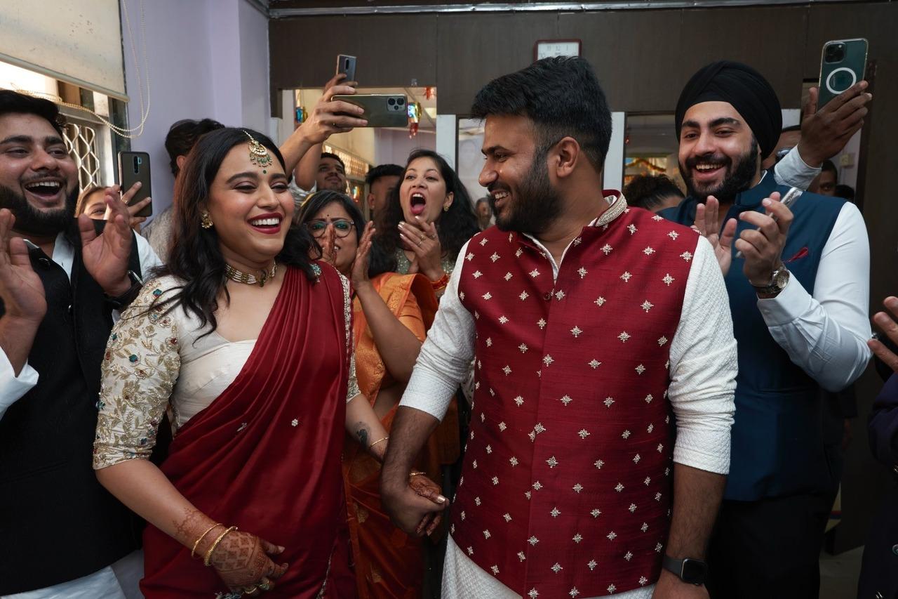 Swara and Fahad share a candid moment in this picture from their civil wedding ceremony.