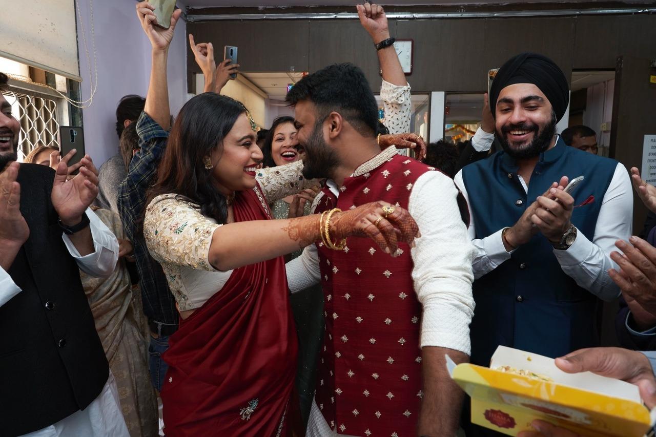 Swara Bhasker and Fahad are seen sealing their first moment at man and wife by sharing a warm after their civil wedding ceremony.