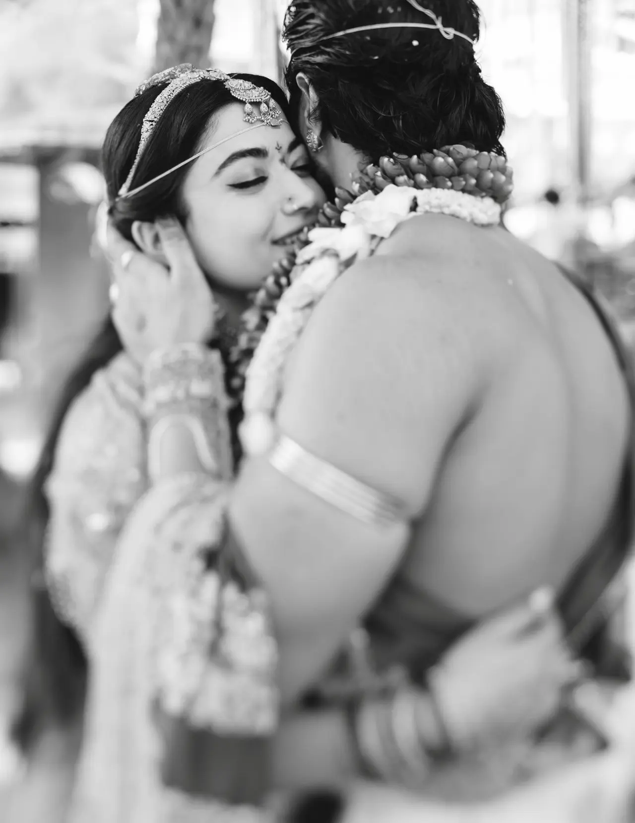 In an adorable black-and-white picture from the ceremony, the couple shared a peaceful hug. 