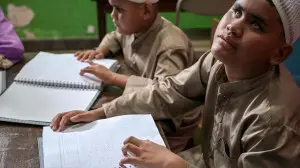 IN PHOTOS: Visually impaired students read Braille Koran during Ramadan