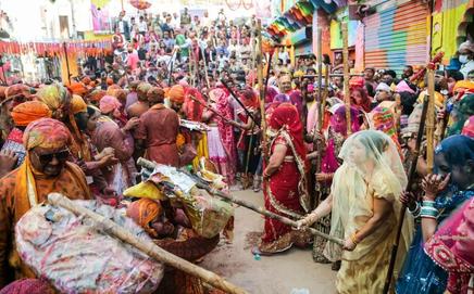 The centuries-old tradition of Lathmar Holi, in which women playfully strike men with sticks, will be celebrated in Barsana on February 25. File Pic