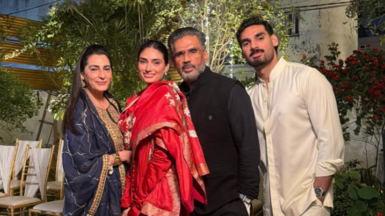 Ahan Shetty poses with Suniel Shetty and Athiya Shetty at ‘Bhai ke shaadi’