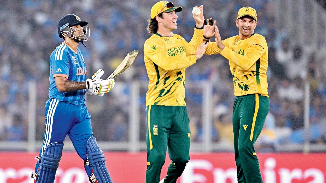 South Africa’s Dewald Brevis (centre) and Keshav Maharaj celebrate the wicket of India skipper Suryakumar Yadav. Pic/AFP