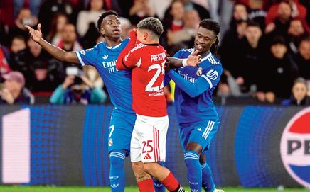 Real Madrid’s Vinicius (left) reacts to Benfica’s Gianluca Prestianni’s (centre) comments during their UCL tie on Tuesday. Pic/Getty Images 