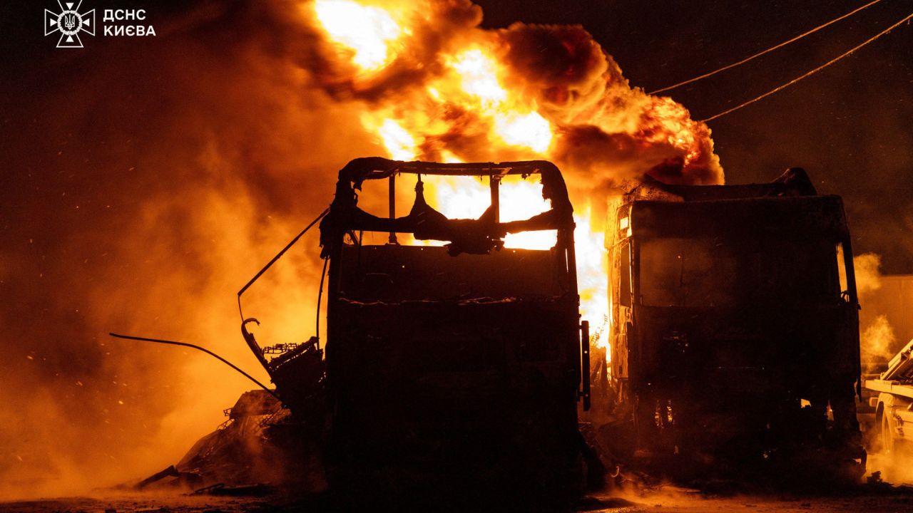 A burning petrol truck is doused by Ukrainian responders after a Russian strike in Kyiv, reflecting the immediate danger faced by civilians and first responders alike