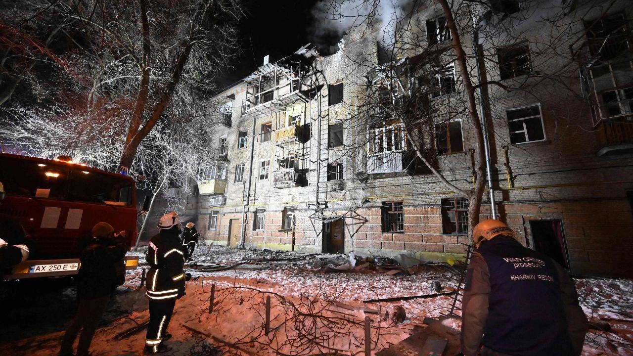 Ukrainian rescuers work at the rubble of a damaged residential building in Kharkiv, the country's second-largest city, where drone attacks wounded 27 people