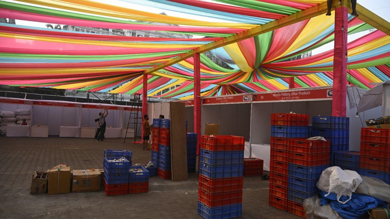 <p>Workers putting up colorful ribbons and decorations at the Kala Ghoda festival entrance</p> <p>Workers putting up colorful ribbons and decorations at the Kala Ghoda festival entrance</p>