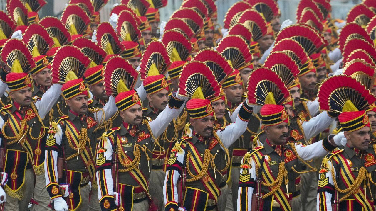 <p>&nbsp;Delhi Police contingent marches under thick grey clouds and persistent rain</p>