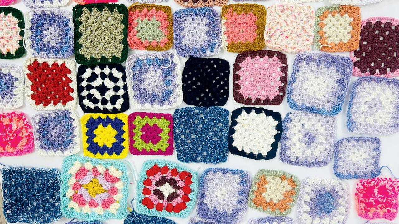 A close-up of granny squares crocheted by children at the NGO