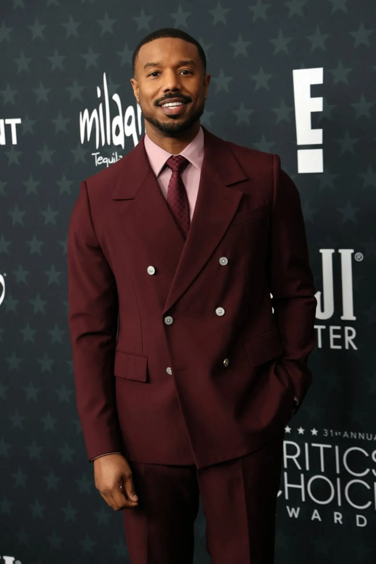 <p>Michael B. Jordan looked dapper as always in a Louis Vuitton burgundy double-breasted suit paired with a pink shirt underneath.</p> <p>Michael B. Jordan looked dapper as always in a Louis Vuitton burgundy double-breasted suit paired with a pink shirt underneath.</p>