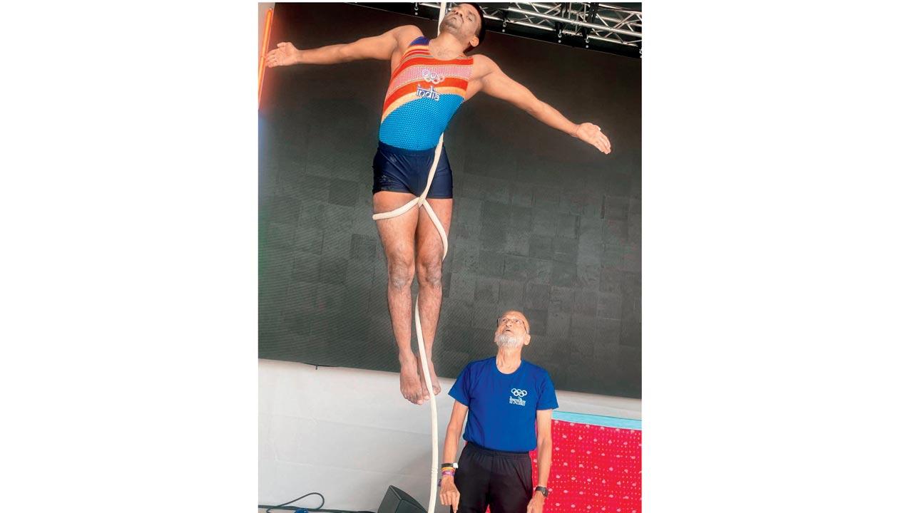 Uday Deshpande (in deep blue) guides Venkatesh Mandadi through a routine 