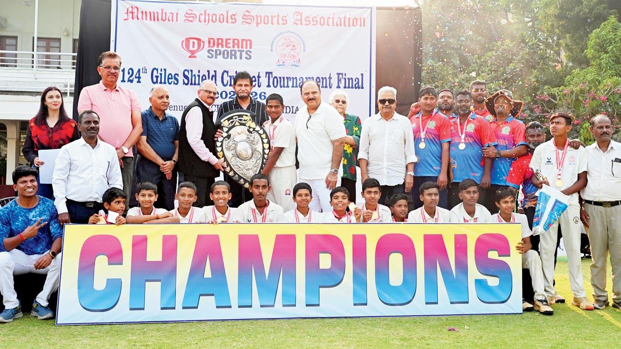 Former India cricketer Sandeep Patil (centre) presents the Giles Shield to victors Dnyandeep Seva Mandal at Brabourne Stadium