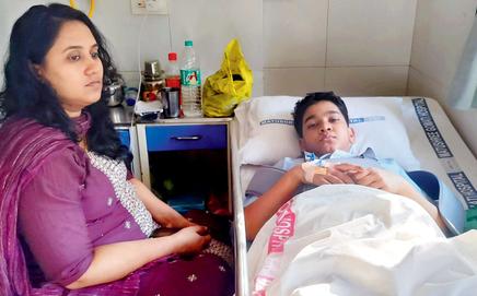 Rudra Susvirkar lies in his hospital bed with his mother, Sanjeevani, by his side after the Goregaon lift accident. Pics/By Special Arrangement