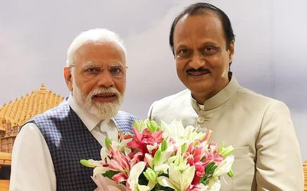 PM Modi with Ajit Pawar. Pic/X