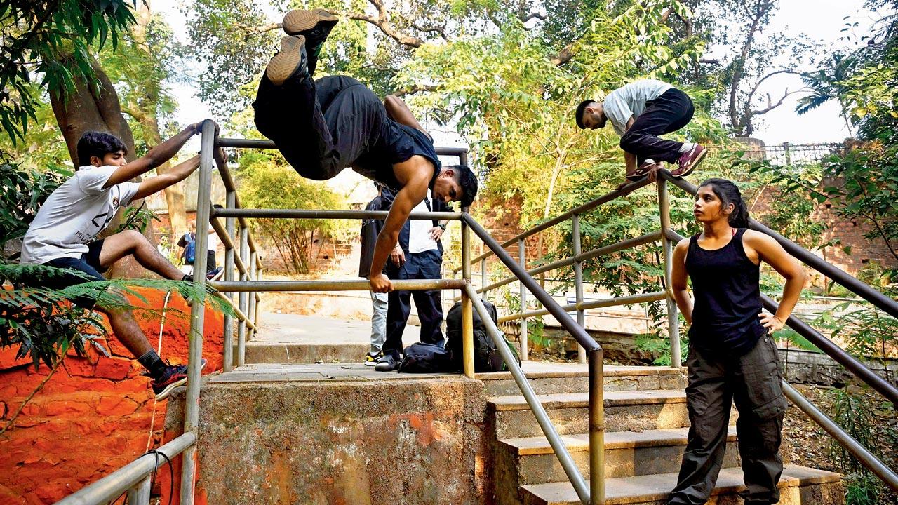 Athletes climb and vault over railings as part of an exercise. Pics/Ashish Raje
