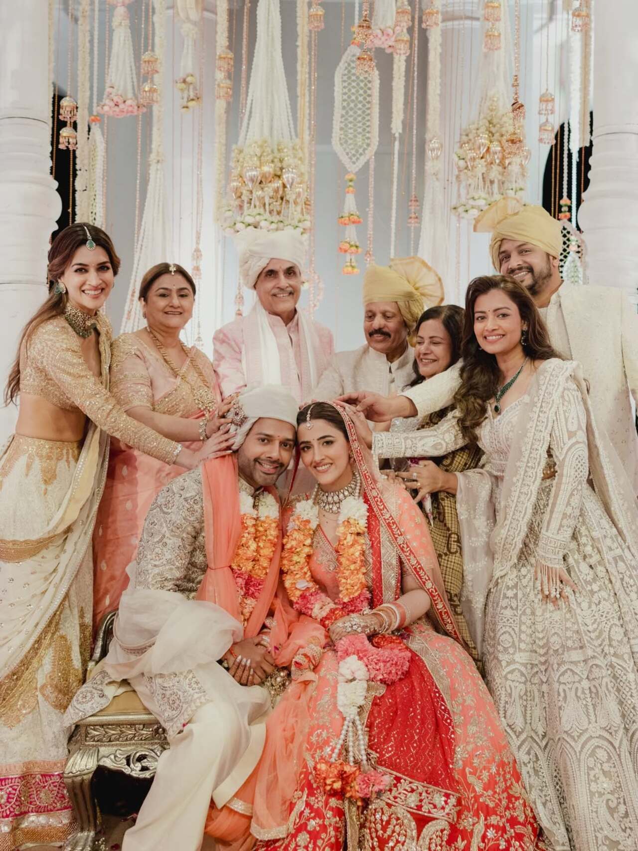 Nupur Sanon and Stebin Ben looked all smiles as they posed with family after their wedding, radiating happiness and love.
