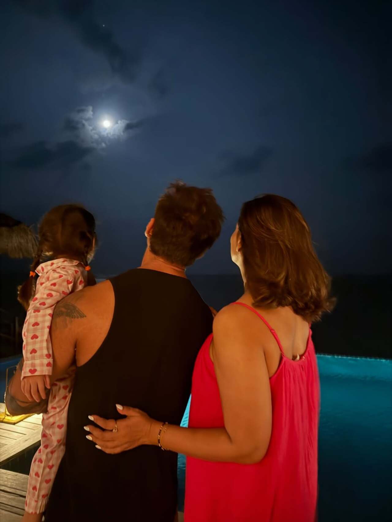 Karan Singh Grover, Bipasha Basu and little Devi were seen gazing at the moon together, sharing a quiet, heartwarming moment.