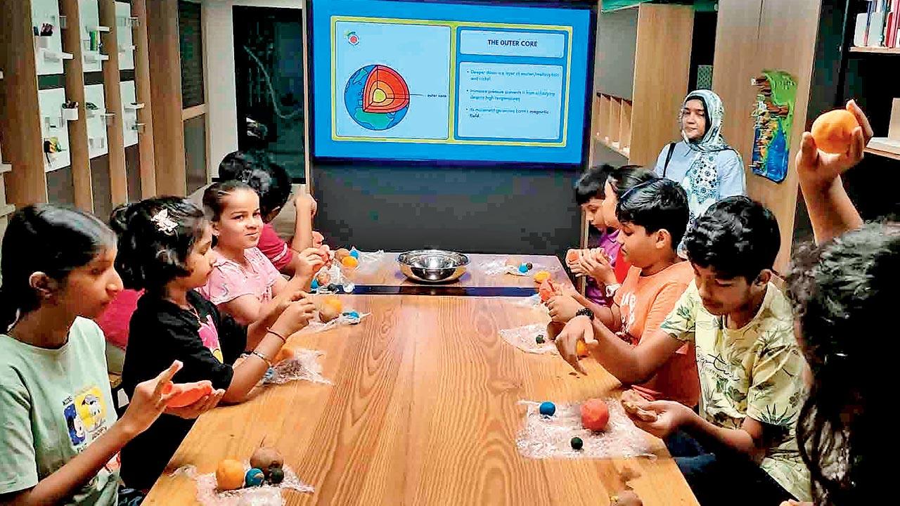 Participants recreate layers of the Earth’s surface including the core, mantle, and the crust using different types of coloured clay 