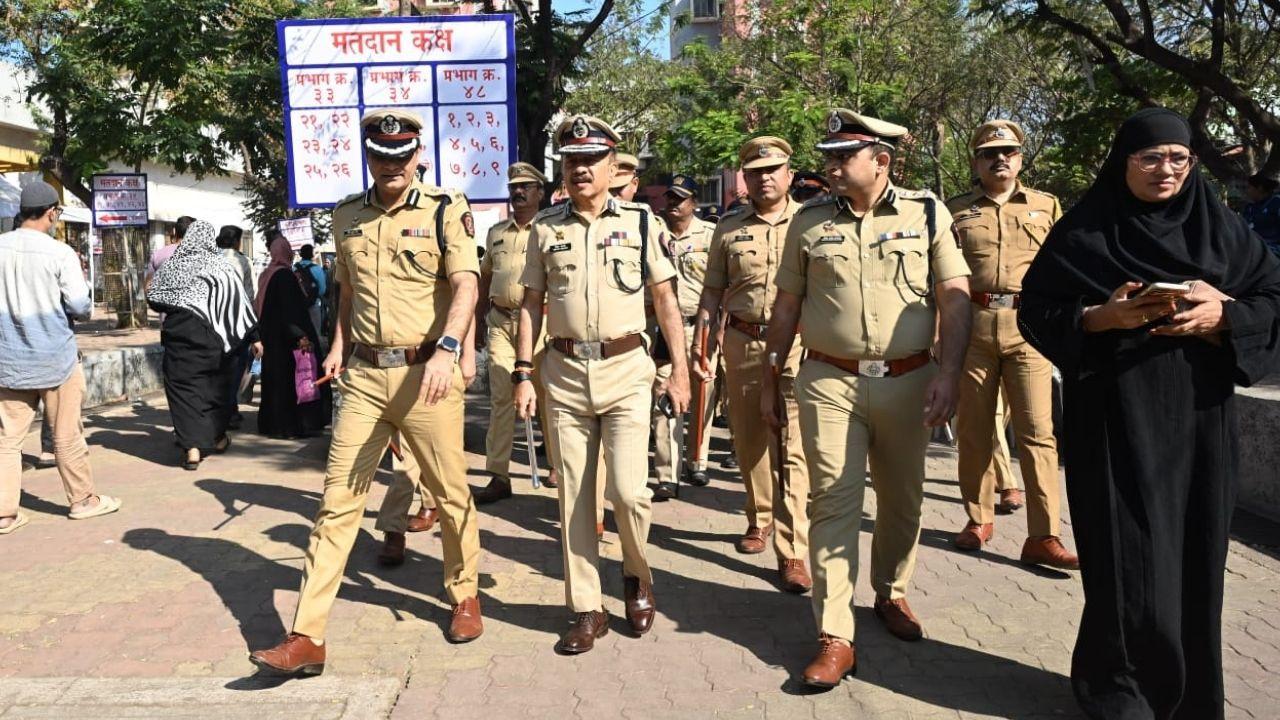 IN PHOTOS: Police Commissioner Deven Bharti inspects Malvani polling centre