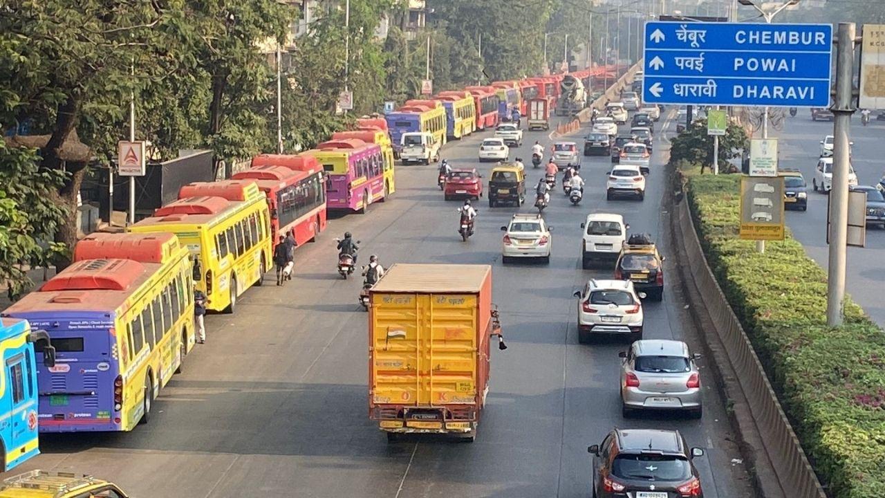 Buses queue on Sion-Panvel Highway to transport EVMs from strong room to election officials a day before the voting day. PIC/ SHADAB KHAN